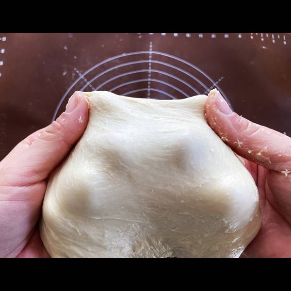 Stretching the dough to see the gluten development