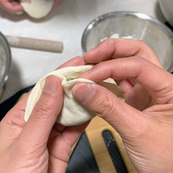Forming pleats on the gyoza