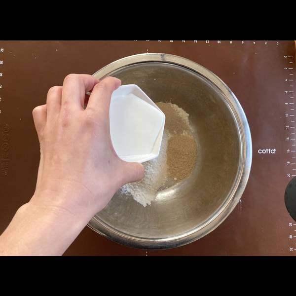 Adding dough ingredients into a bowl