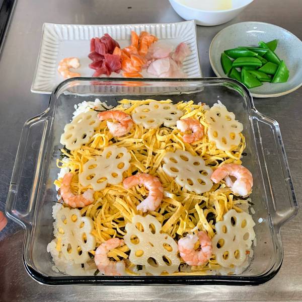Adding lotus root and shrimps on top