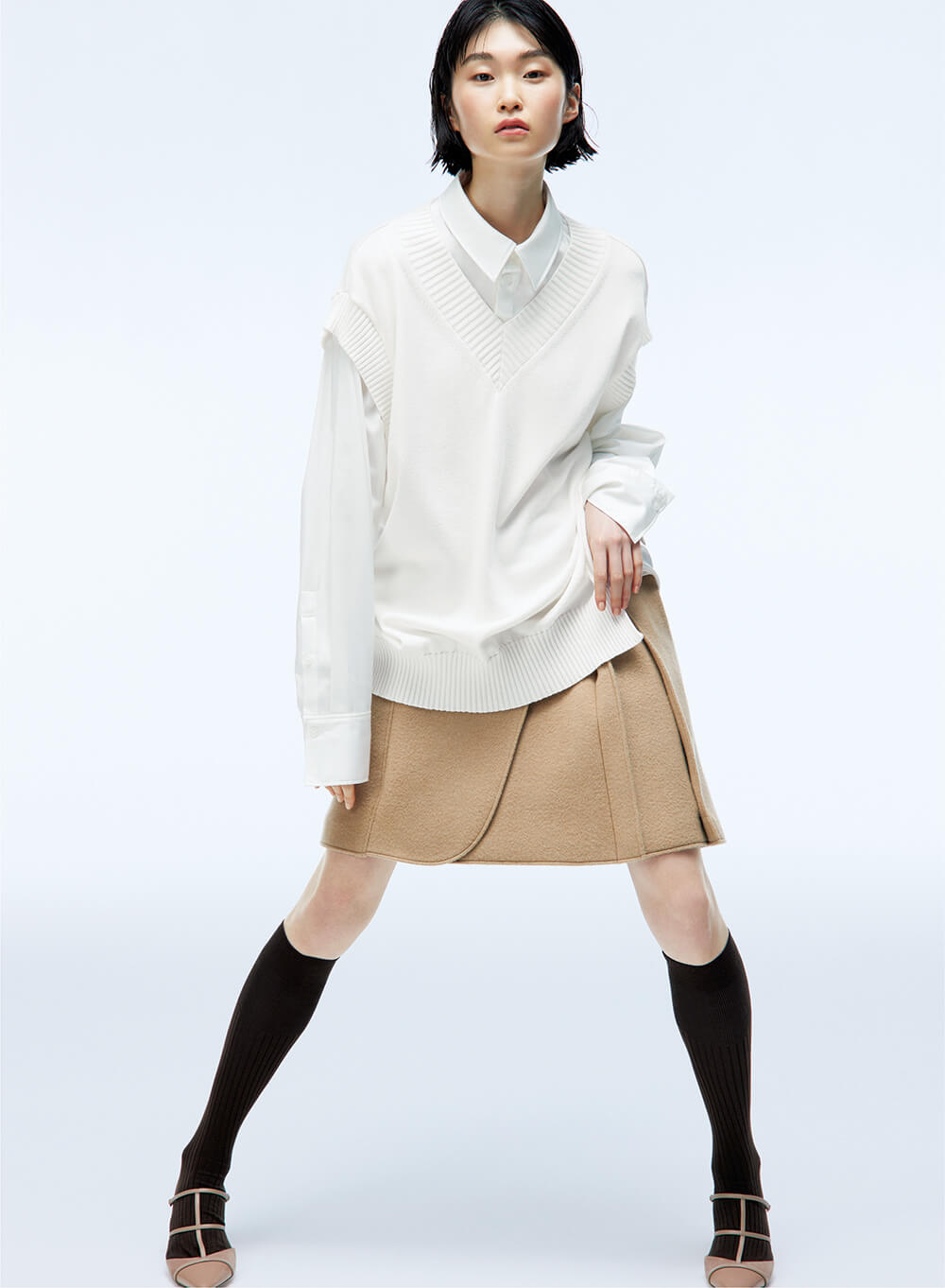 model wearing unisex oversized blouse and skirt