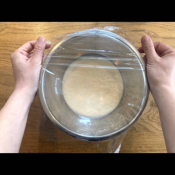 Covering the mochi dough with plastic wrap 
