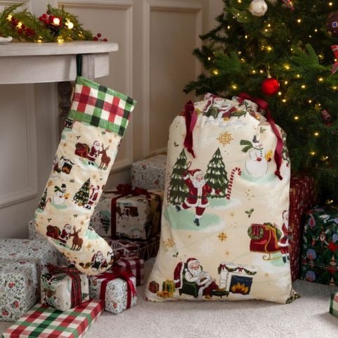 A matching Christmas stocking and sack set with a printed design of snowmen, reindeer and jolly santas.