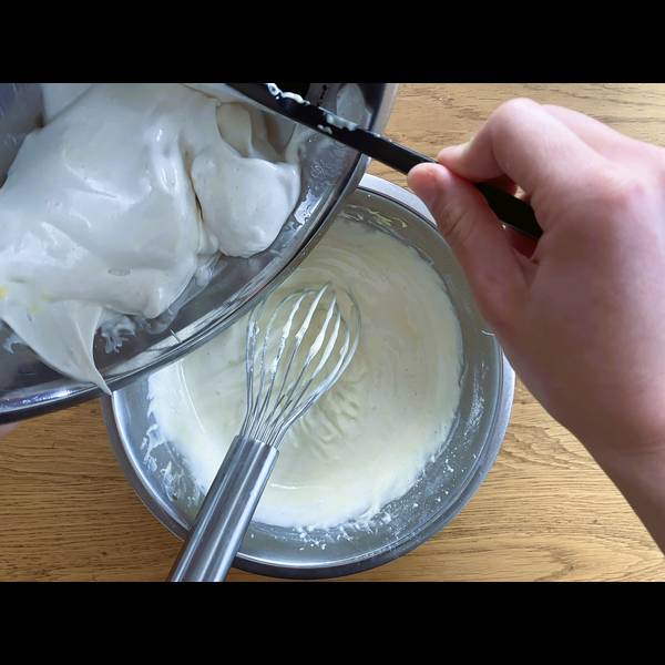 Adding the egg whites into the cheese cake batter, the second time