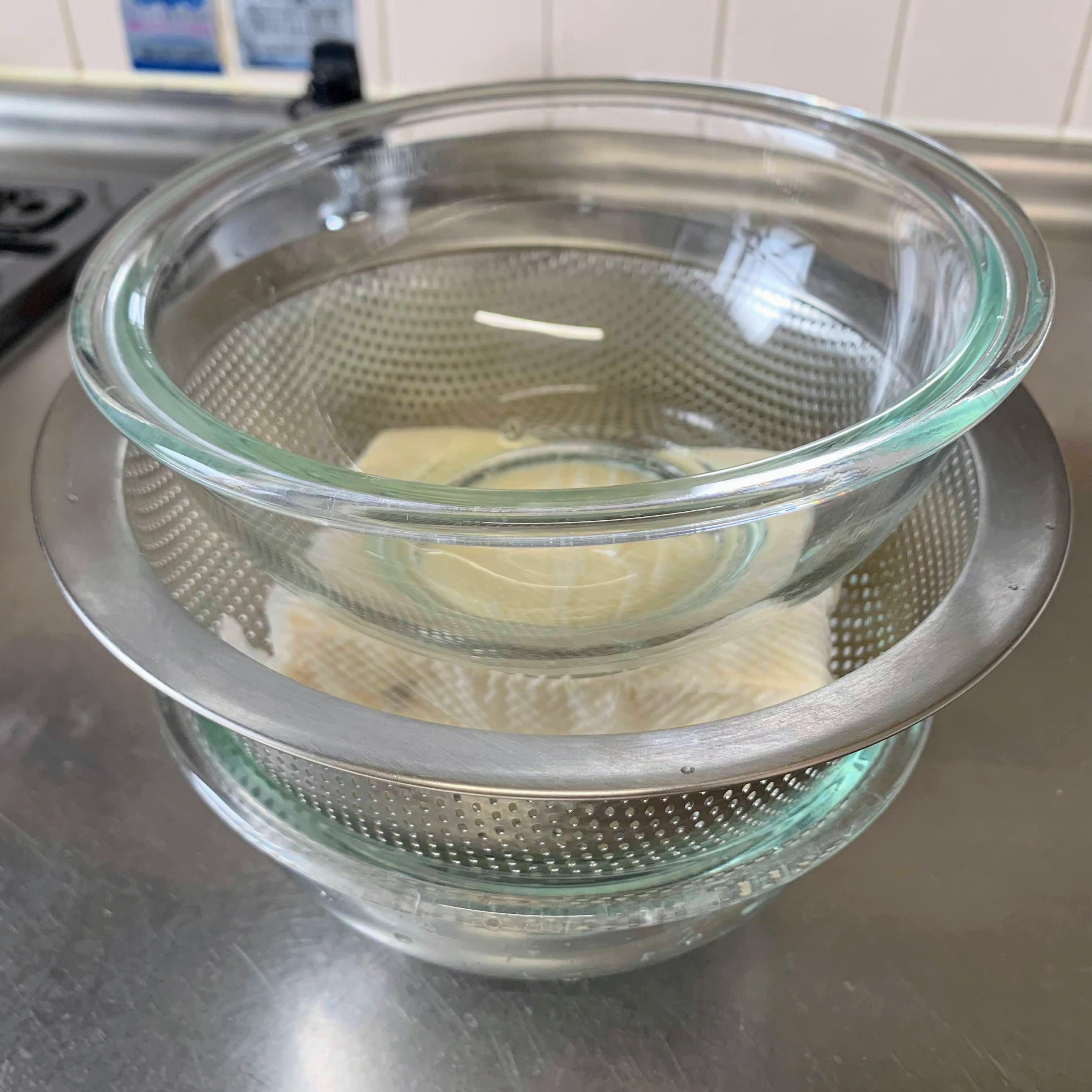 Putting a weight on top of the tofu