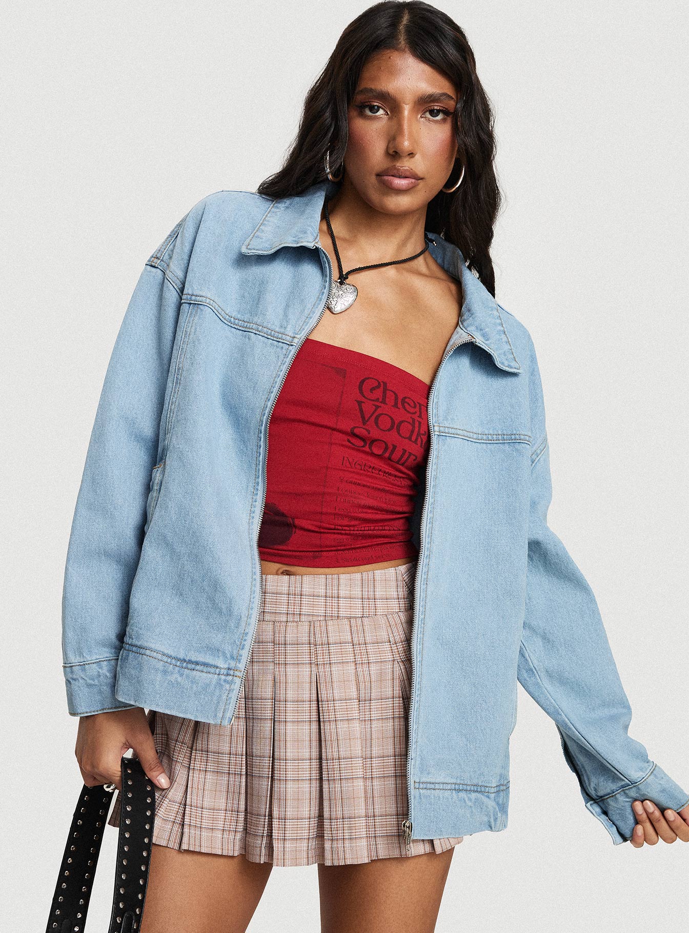 woman wearing denim bomber jacket