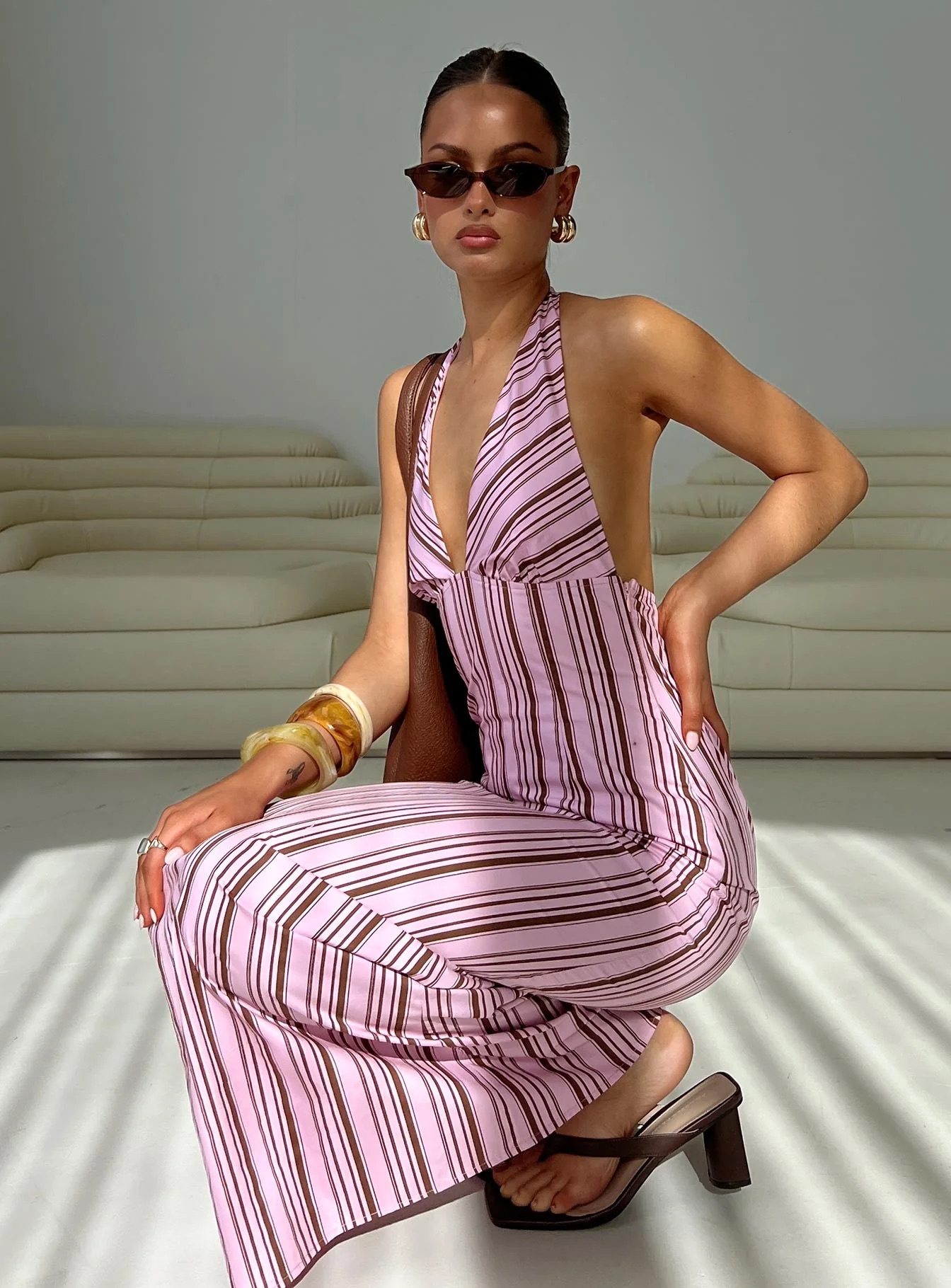 woman wearing pink halter maxi dress in europe