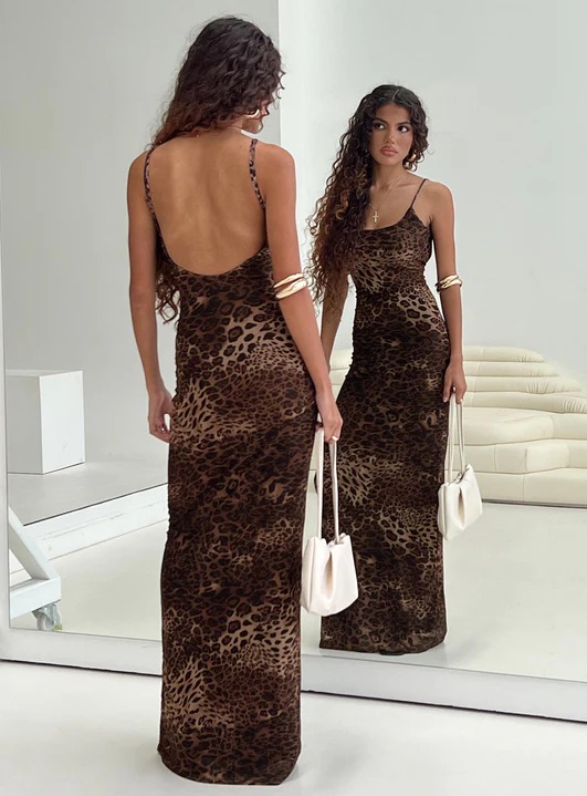 woman wearing leopard print maxi dress in europe