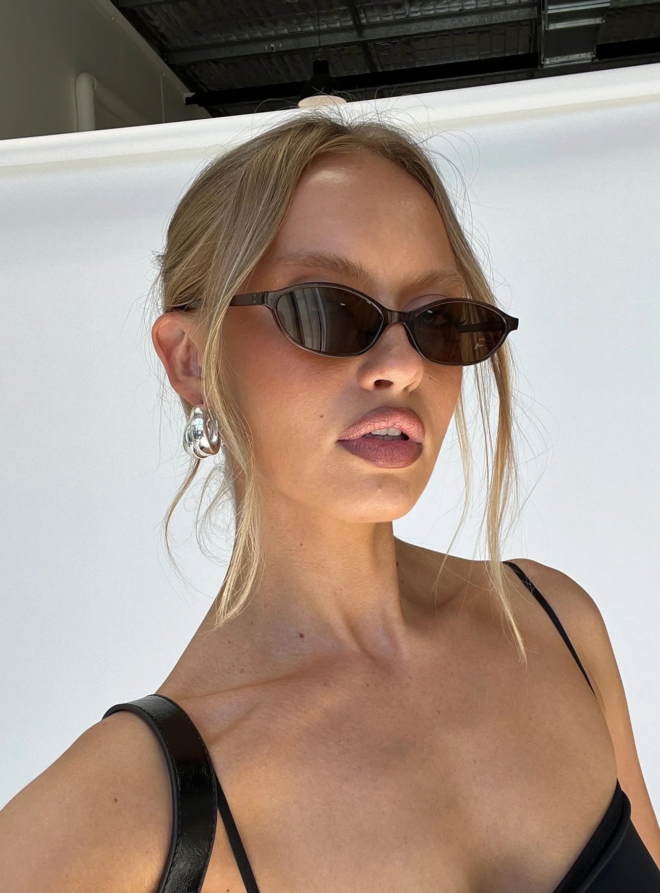 woman wearing brown sunglasses in europe