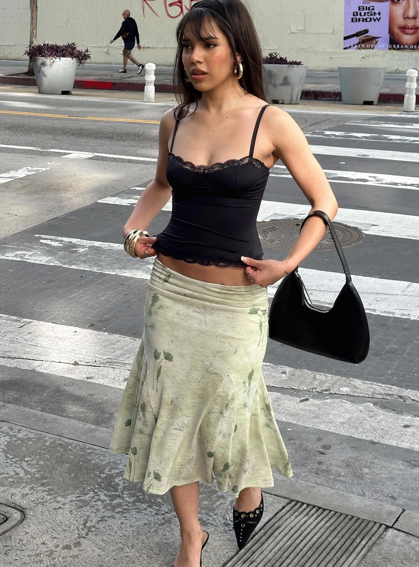 woman wearing green floral midi skirt