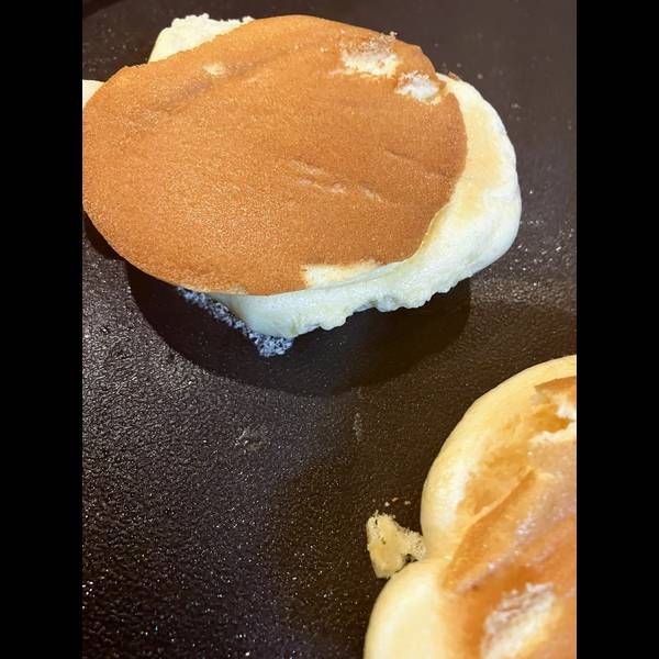Flipped pancakes, letting the other side cook 