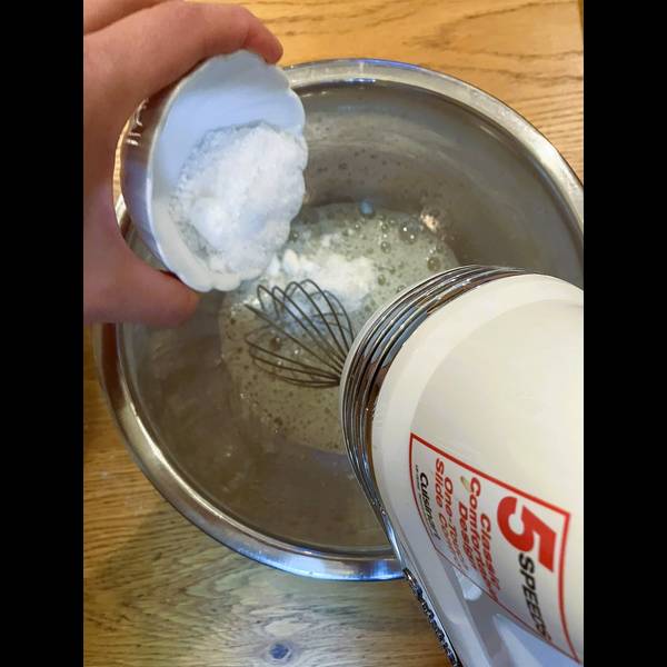Adding sugar into the egg whites