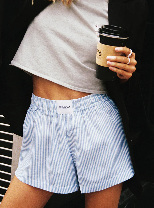 woman wearing blue / white boxer shorts