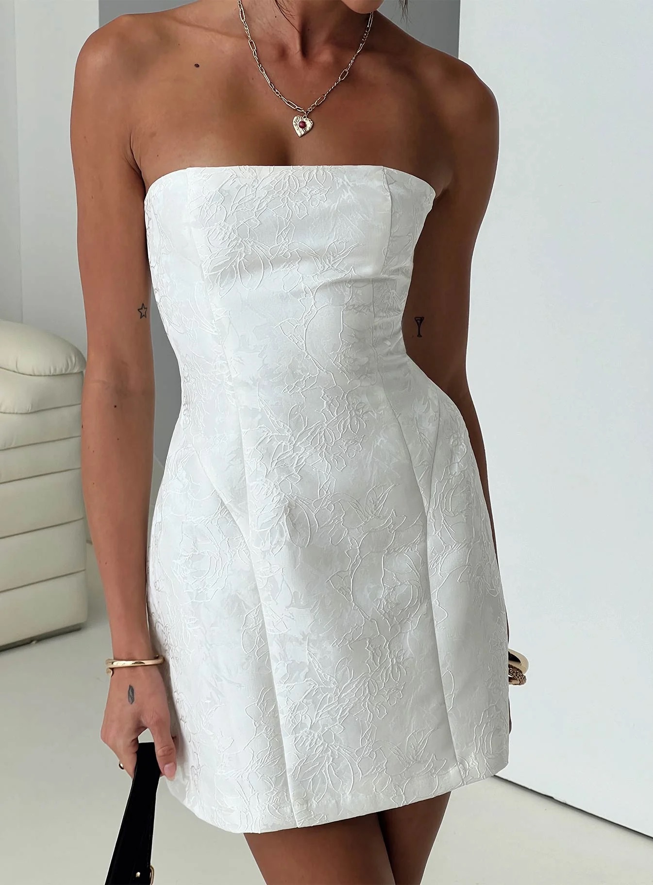 how to style white homecoming dress - model wearing white homecoming dress