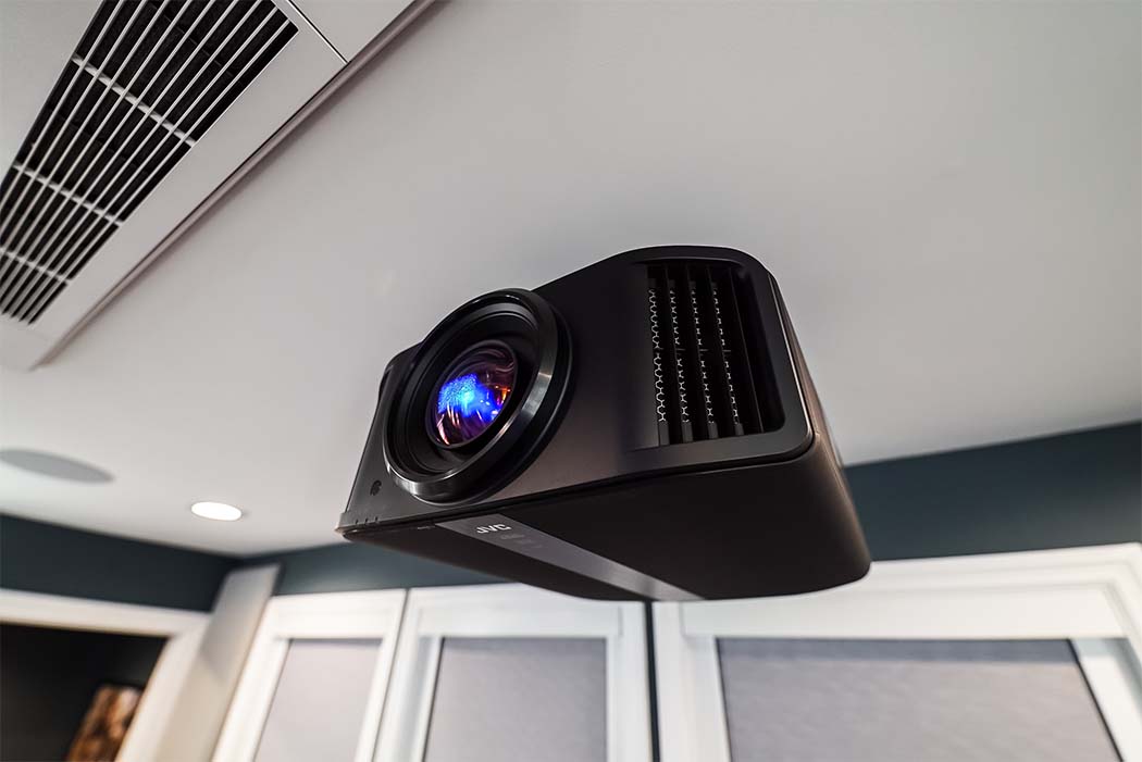 Home theater projector mounted on a ceiling