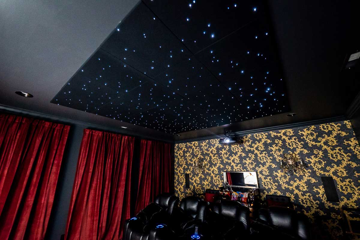 Star ceiling and red curtains in home theater