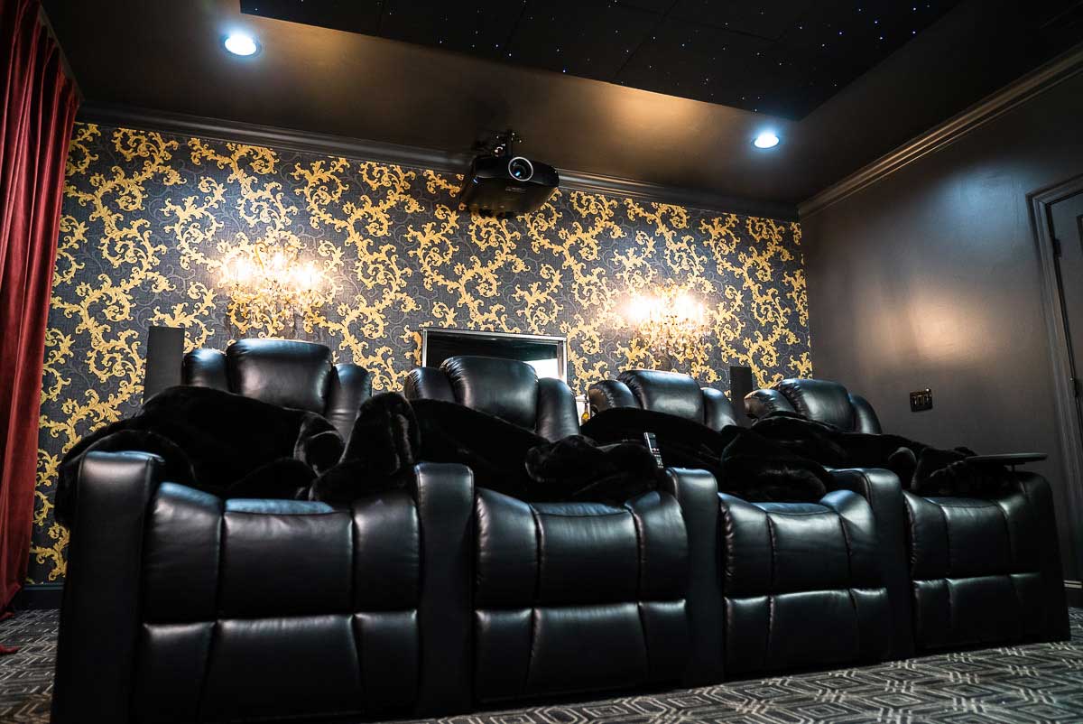 Row of 4 Audio Advice Revolution home theater seats in a home theater