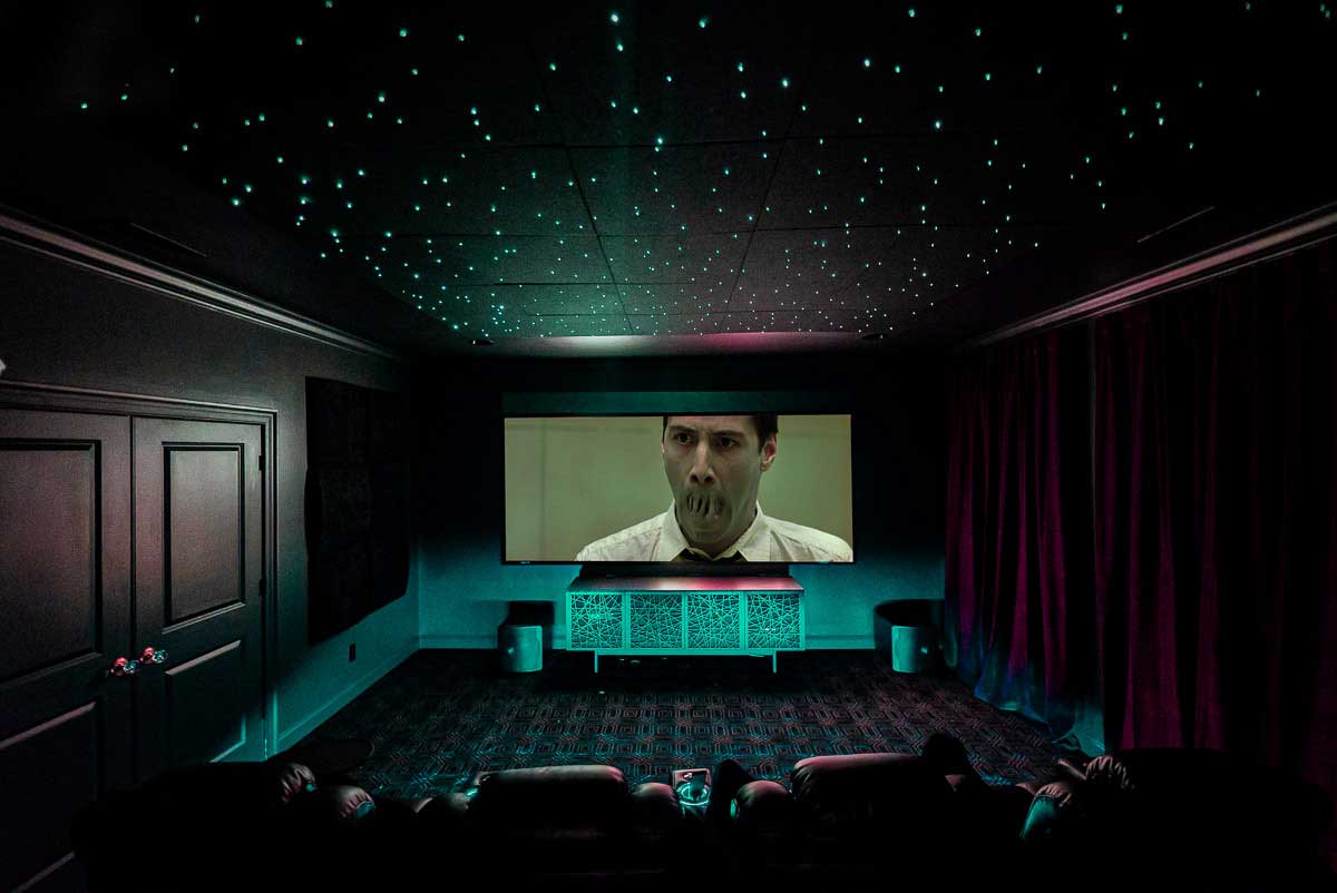 The Maxtrix playing in home theater with star ceiling