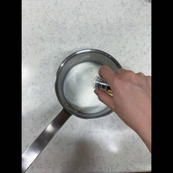 Adding vanilla beans to the milk