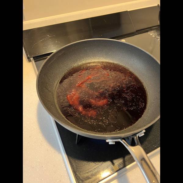 Simmering the demi-glaze sauce ingredients
