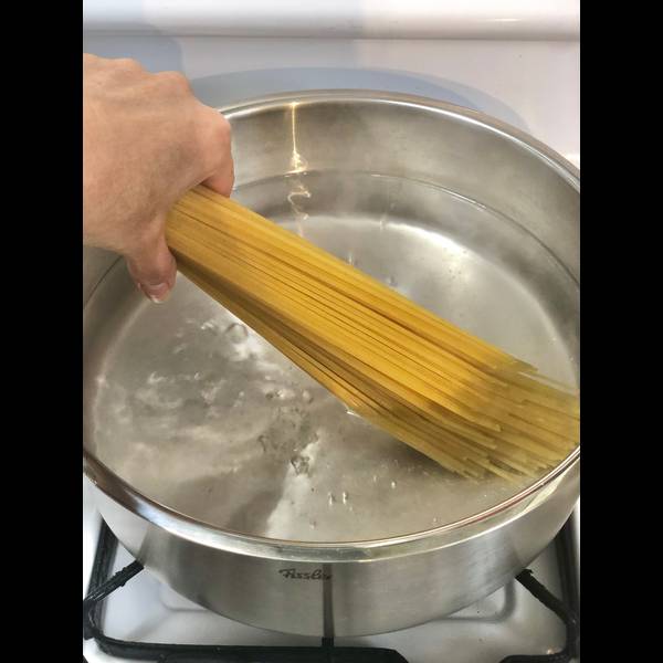 Adding the pasta to the boiling water