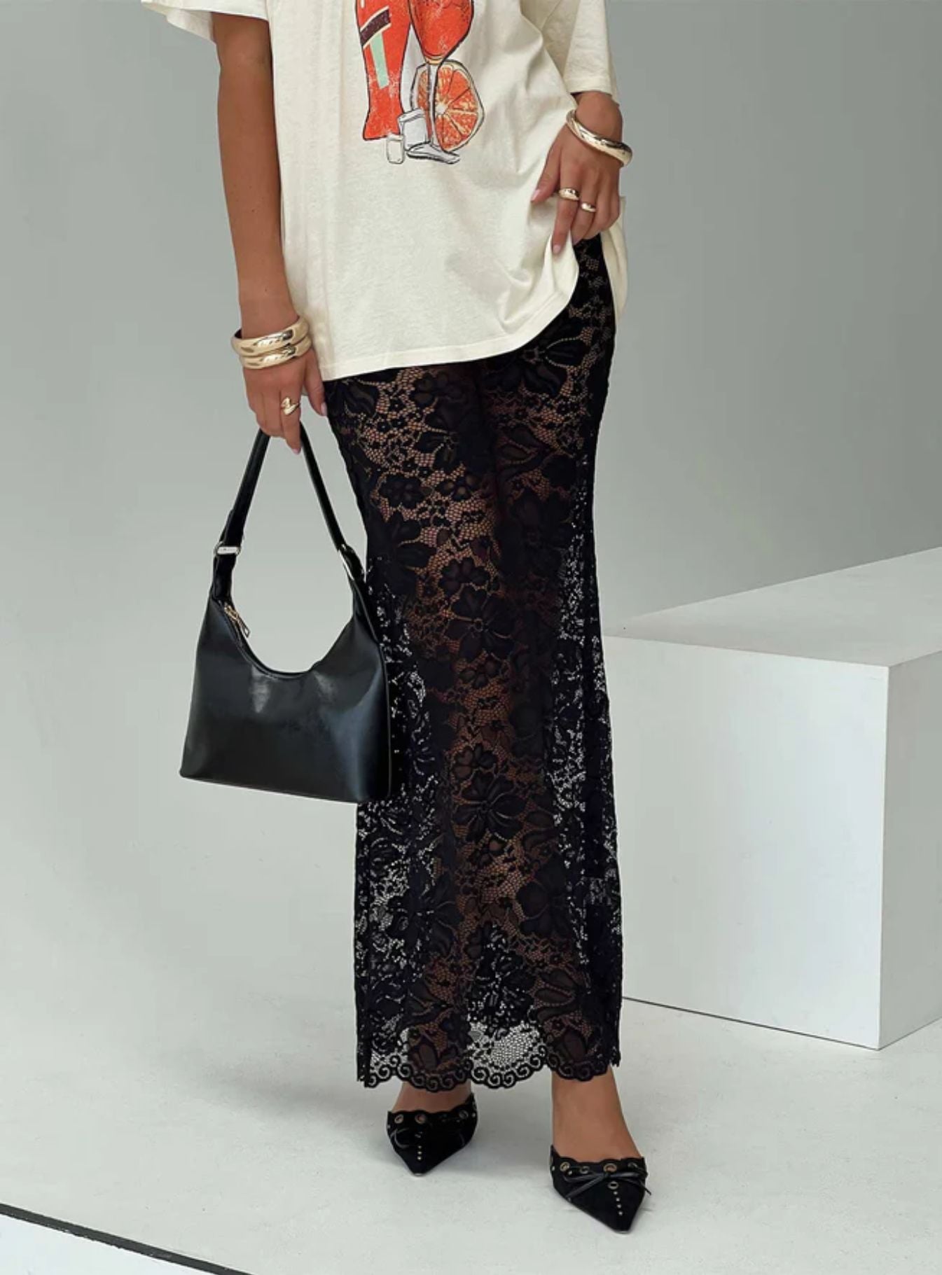 woman wearing black lace maxi skirt for spring brunch