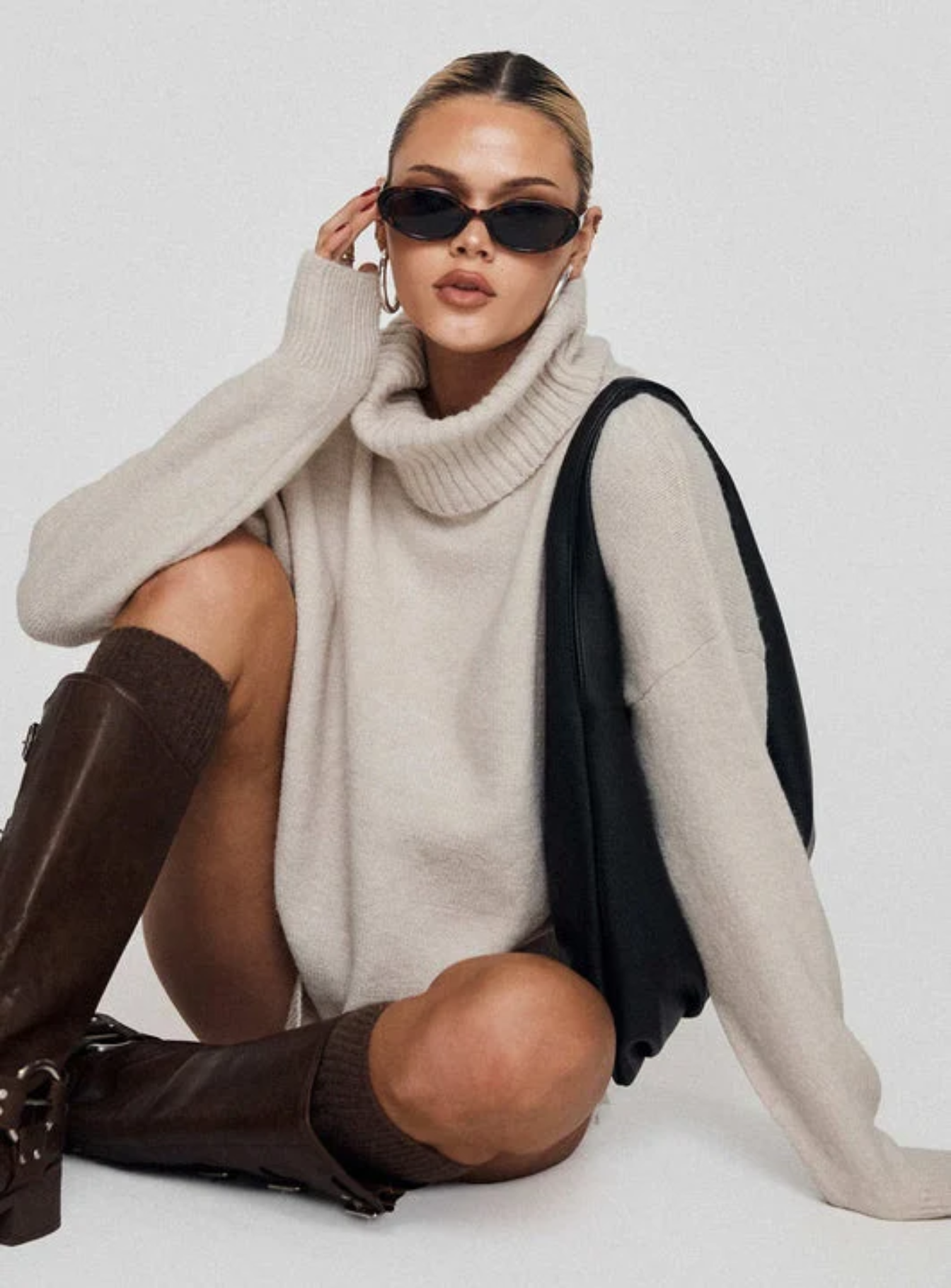 woman wearing oatmeal turtleneck sweater