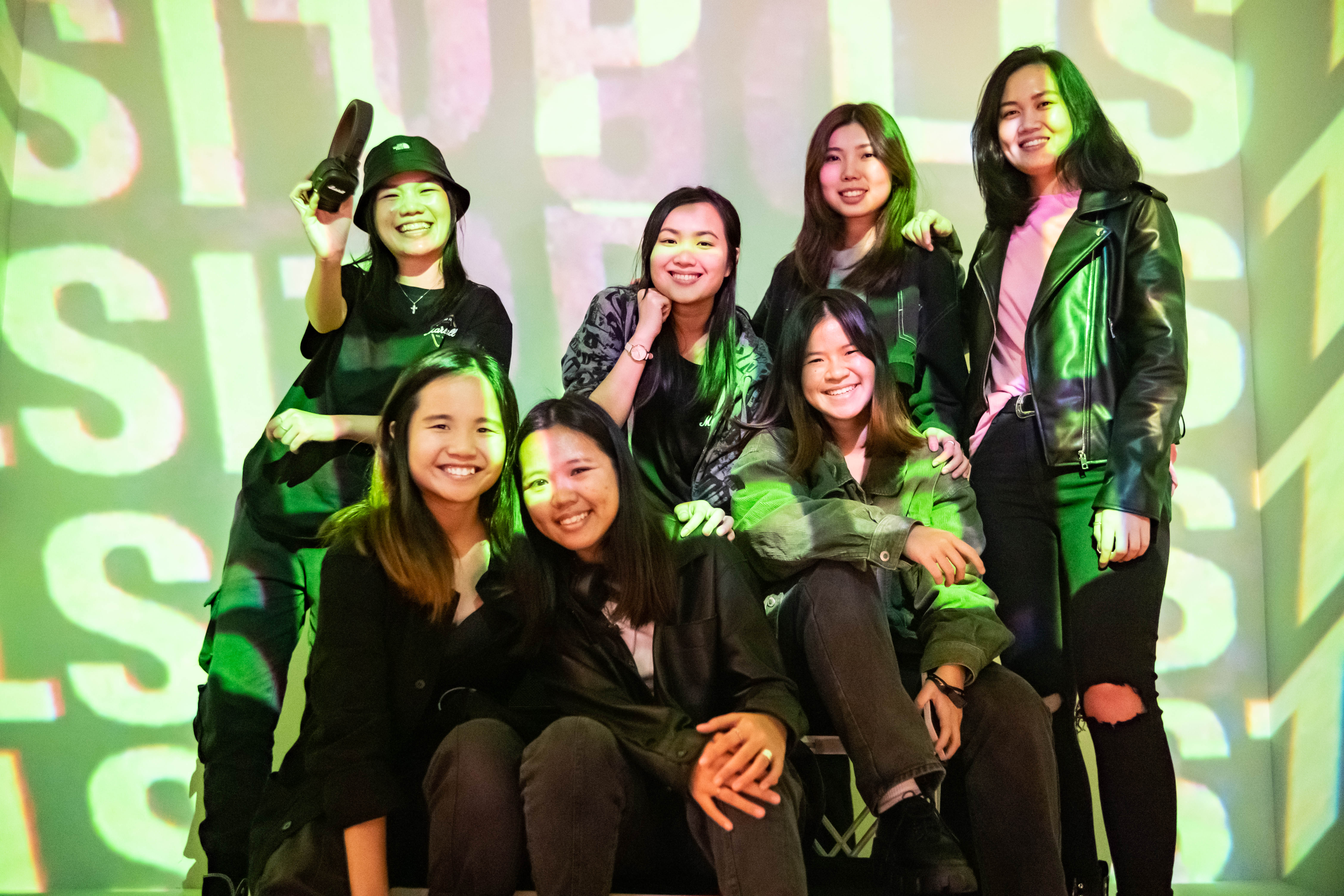 a group of people at a projection mapping photobooth