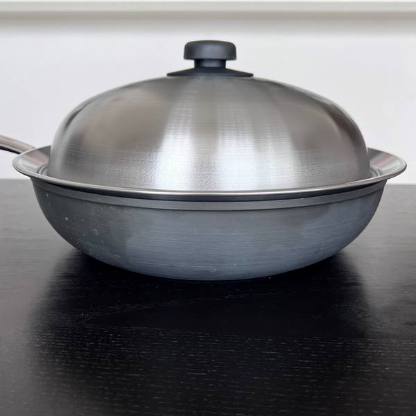 Steaming lid on top of fry pan