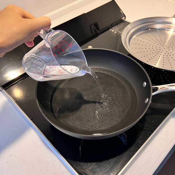 Placing water into frypan