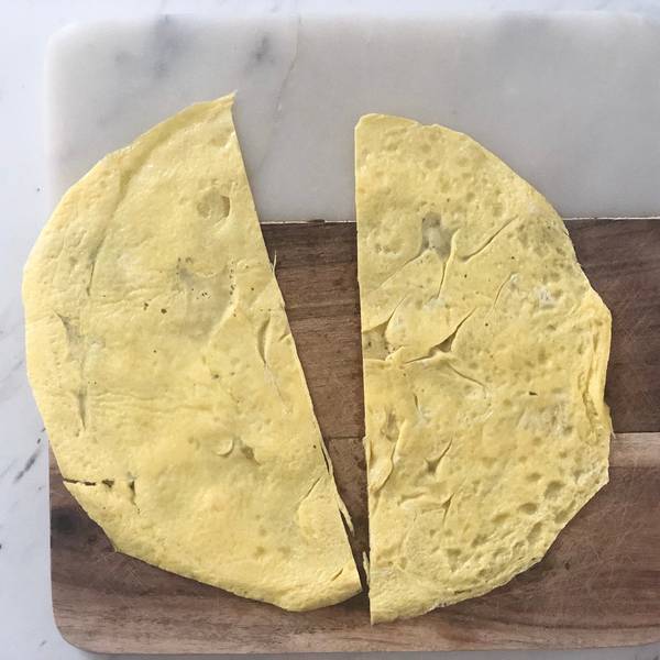 Cutting the omelet in half