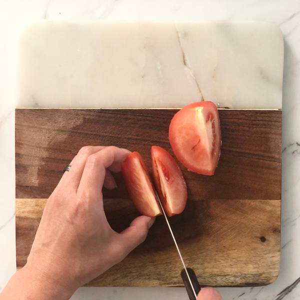 Cutting tomato into wedges