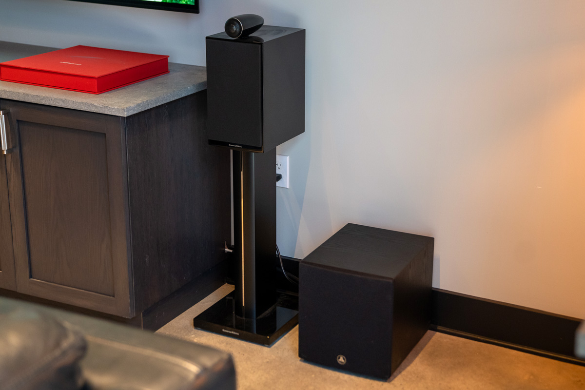 Bookshelf speaker on a stand and subwoofer