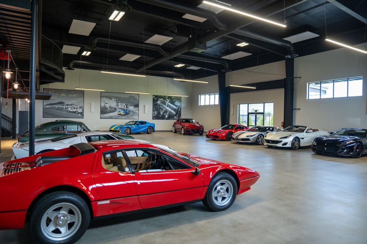 Car garage showcase with a red car in the foreground