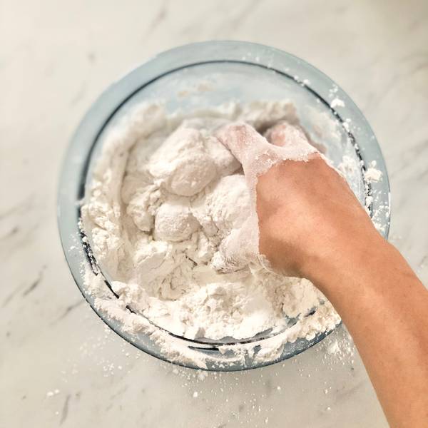 Continuing to knead the dough with hands