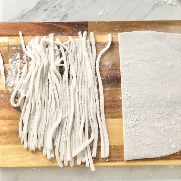 Cutting udon noodles out of the dough