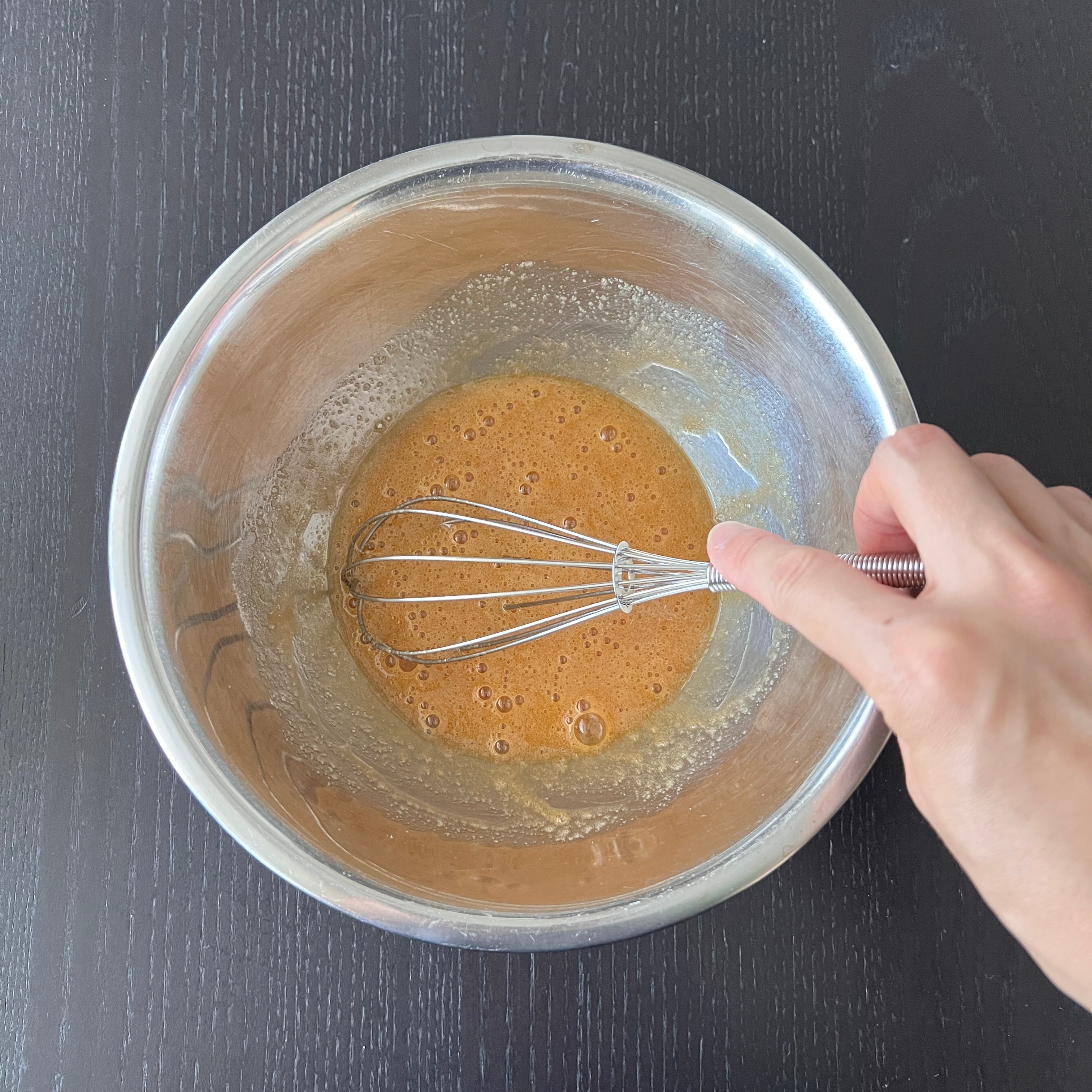 mixing the egg and sugar together