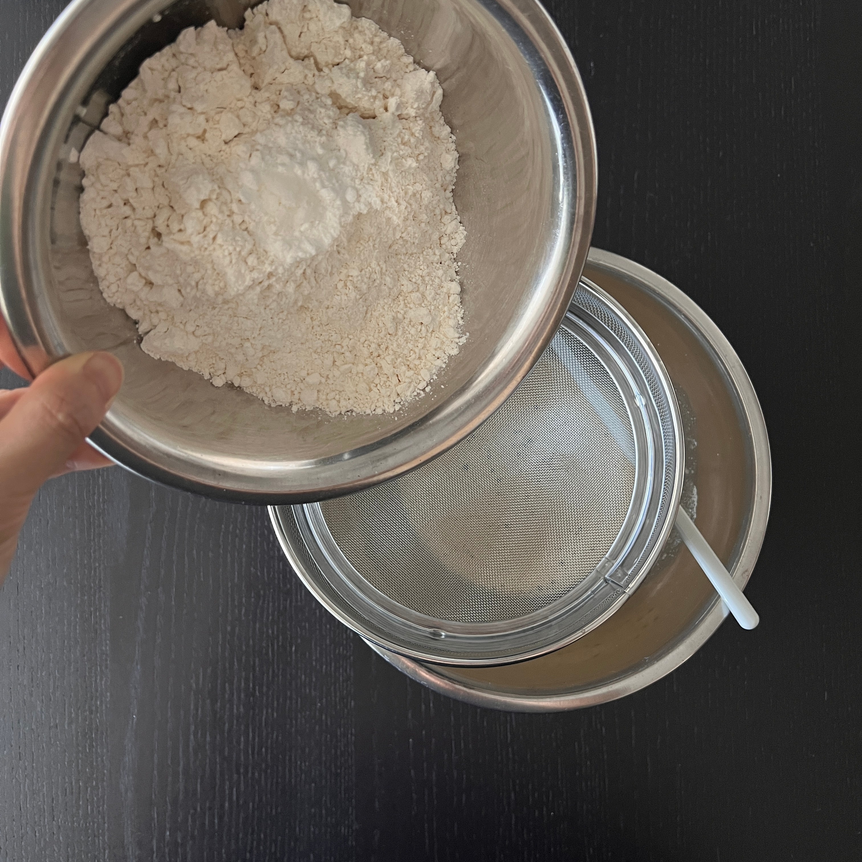 Pouring the dry ingredients into the wet ingredients