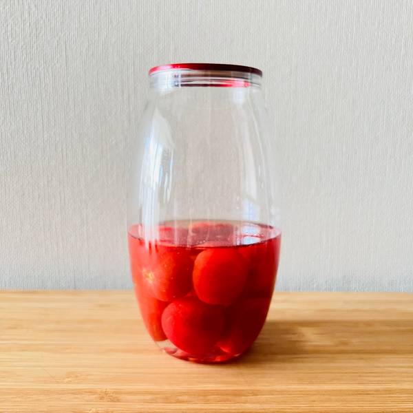Cherry tomatoes in a jar with pickling solution