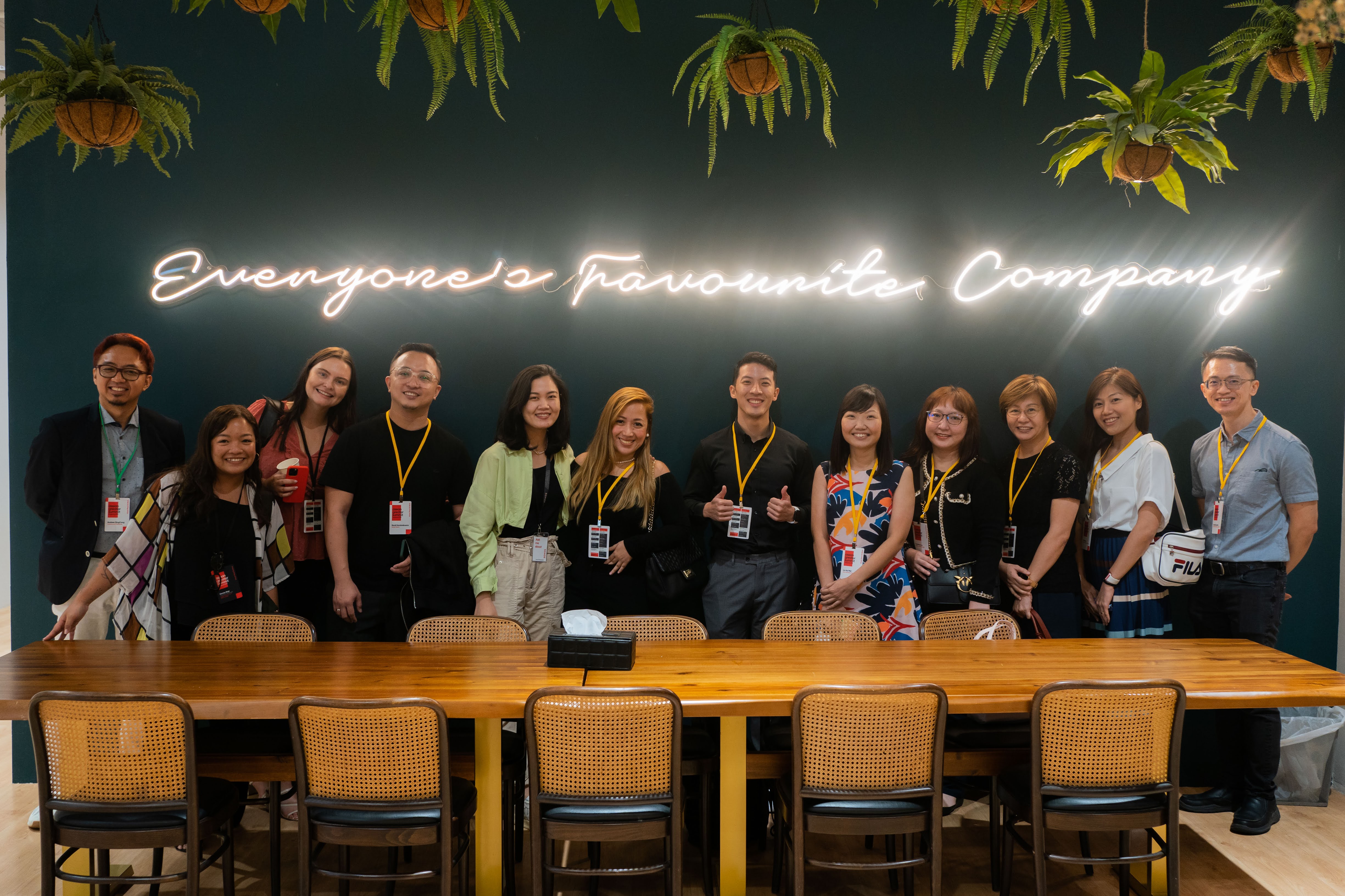 
Group of people with neon light signage 