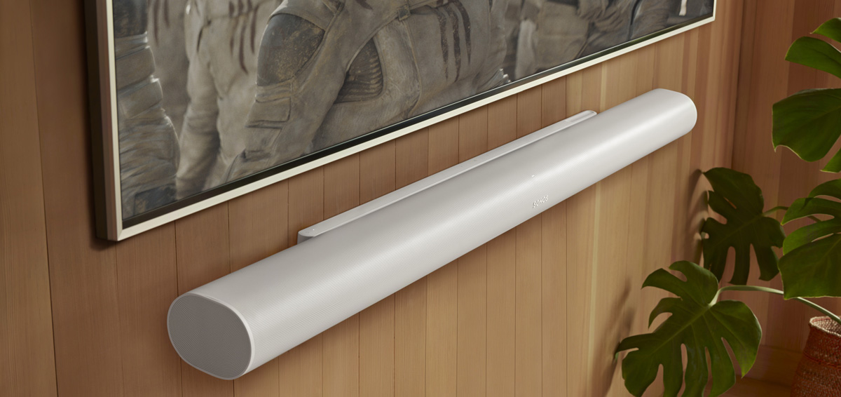 Sonos Arc Ultra Soundbar in white mounted on a wall below a television