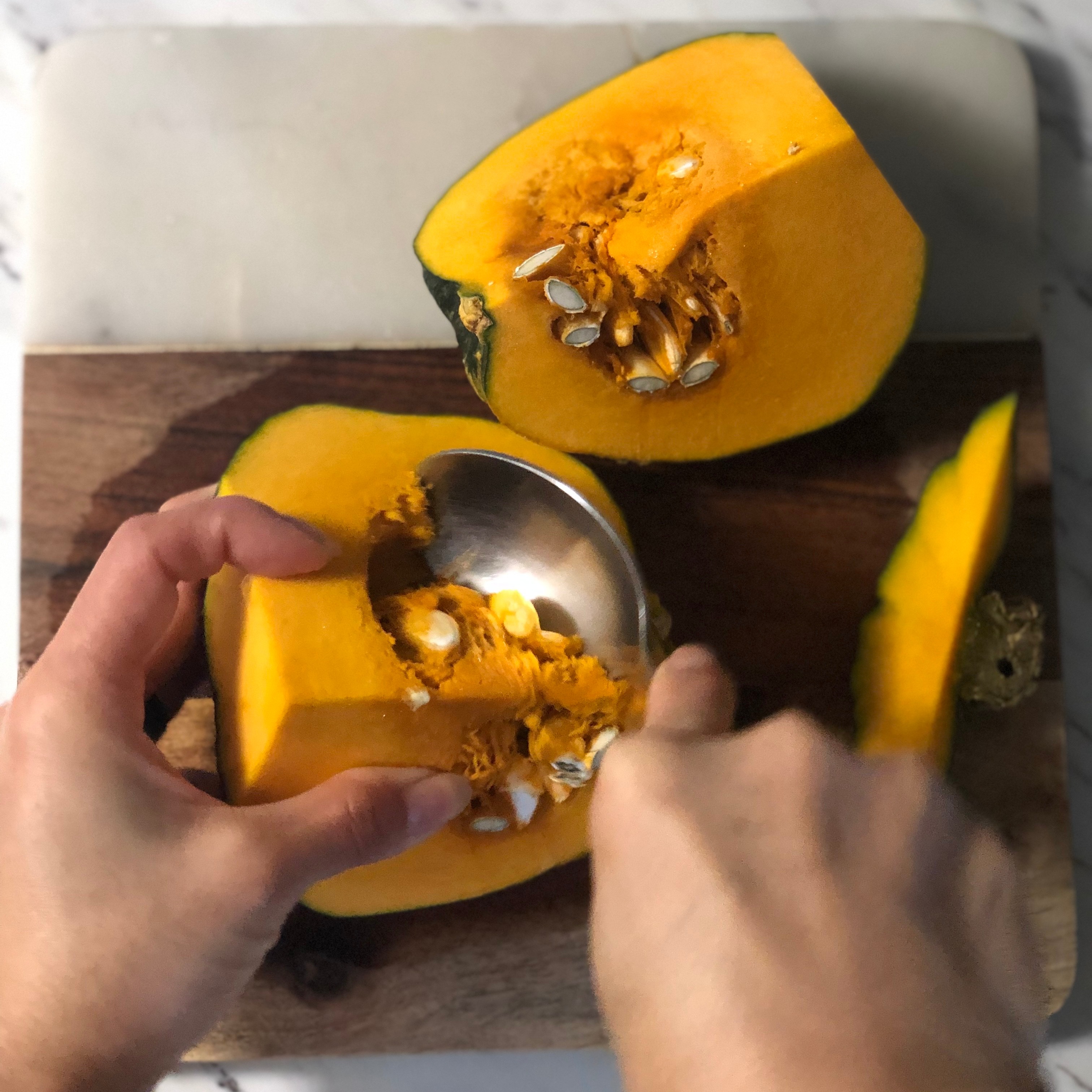Taking the seeds out of the kabocha