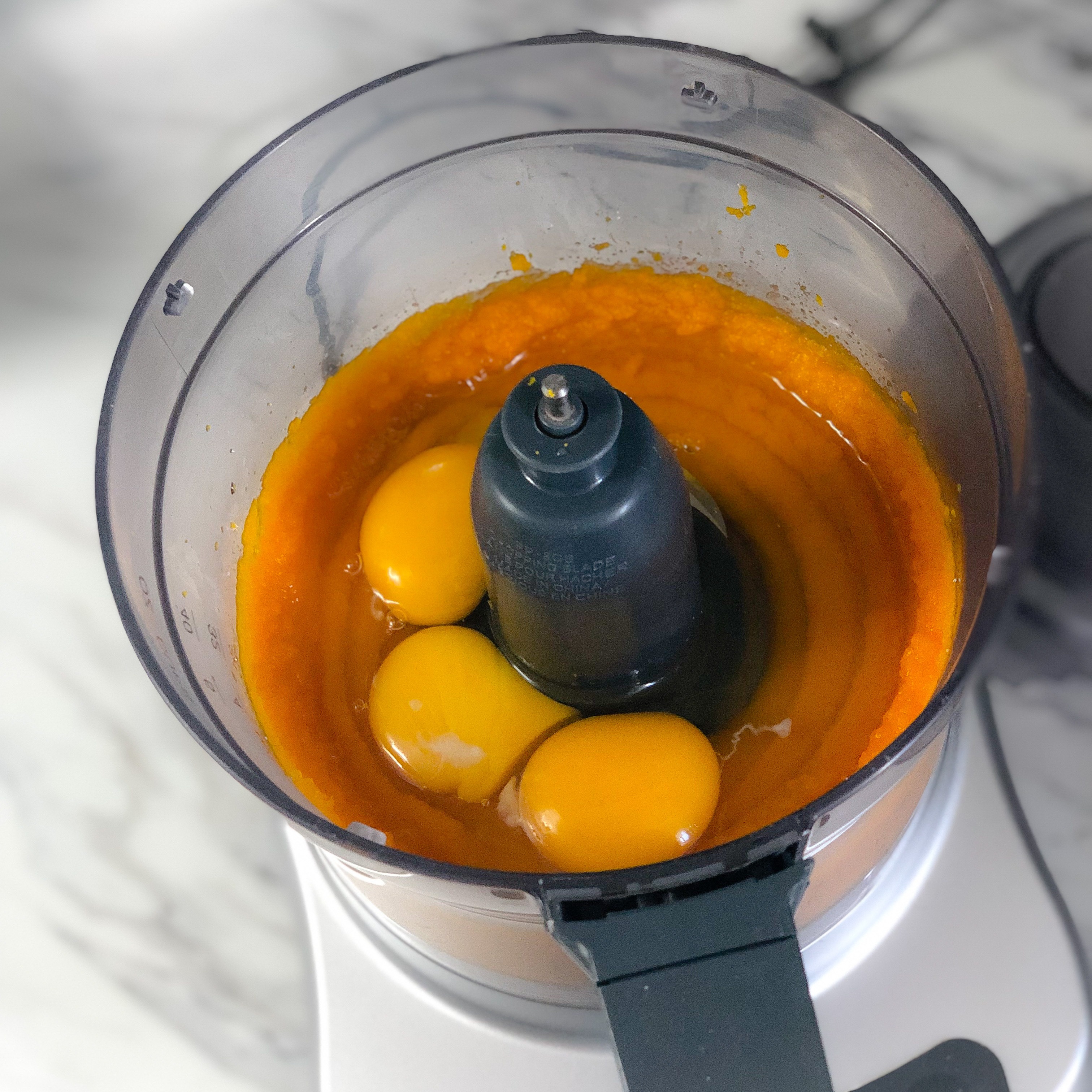 Adding in 3 eggs to the pureed kabocha mixture