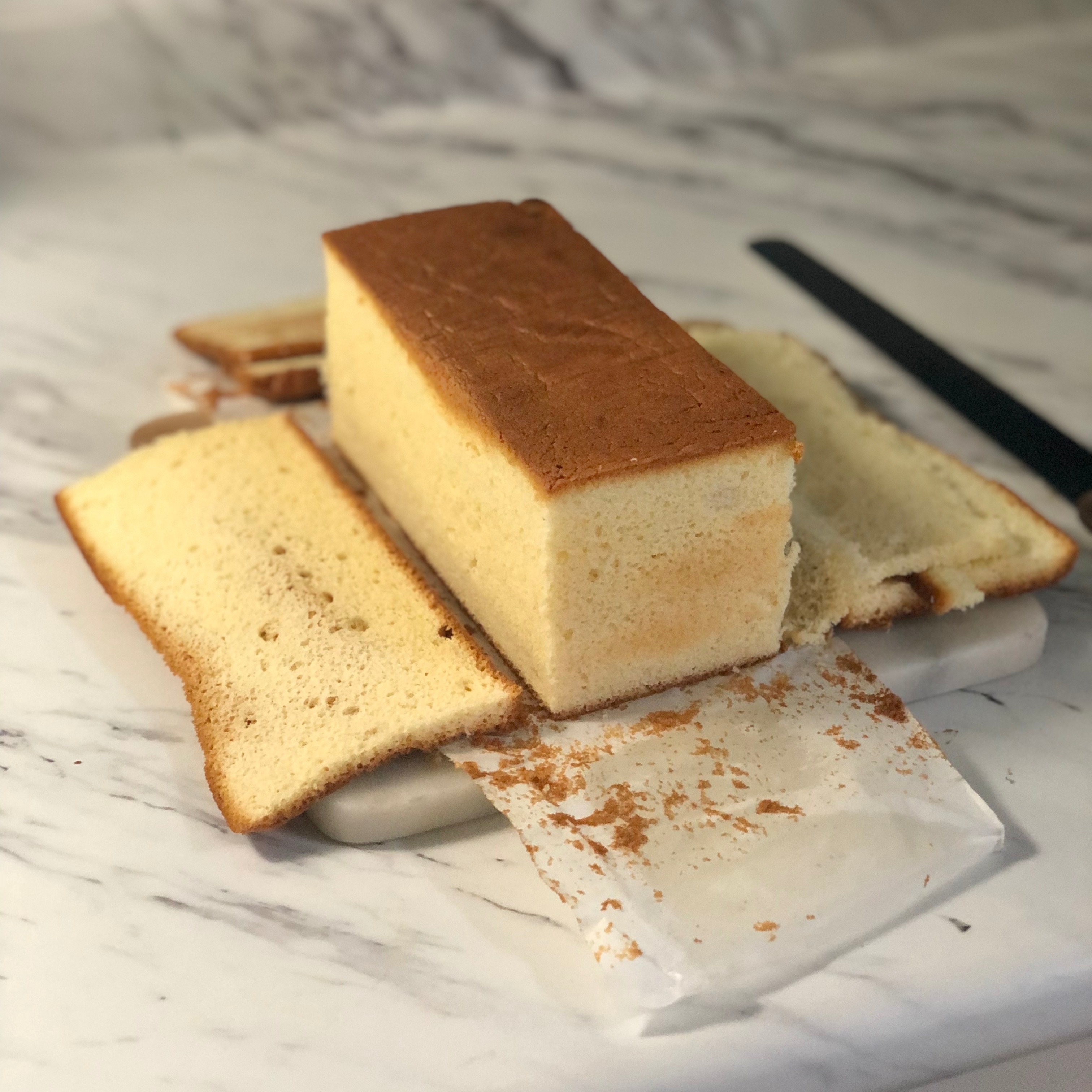 Cutting the sides off of the castella cake