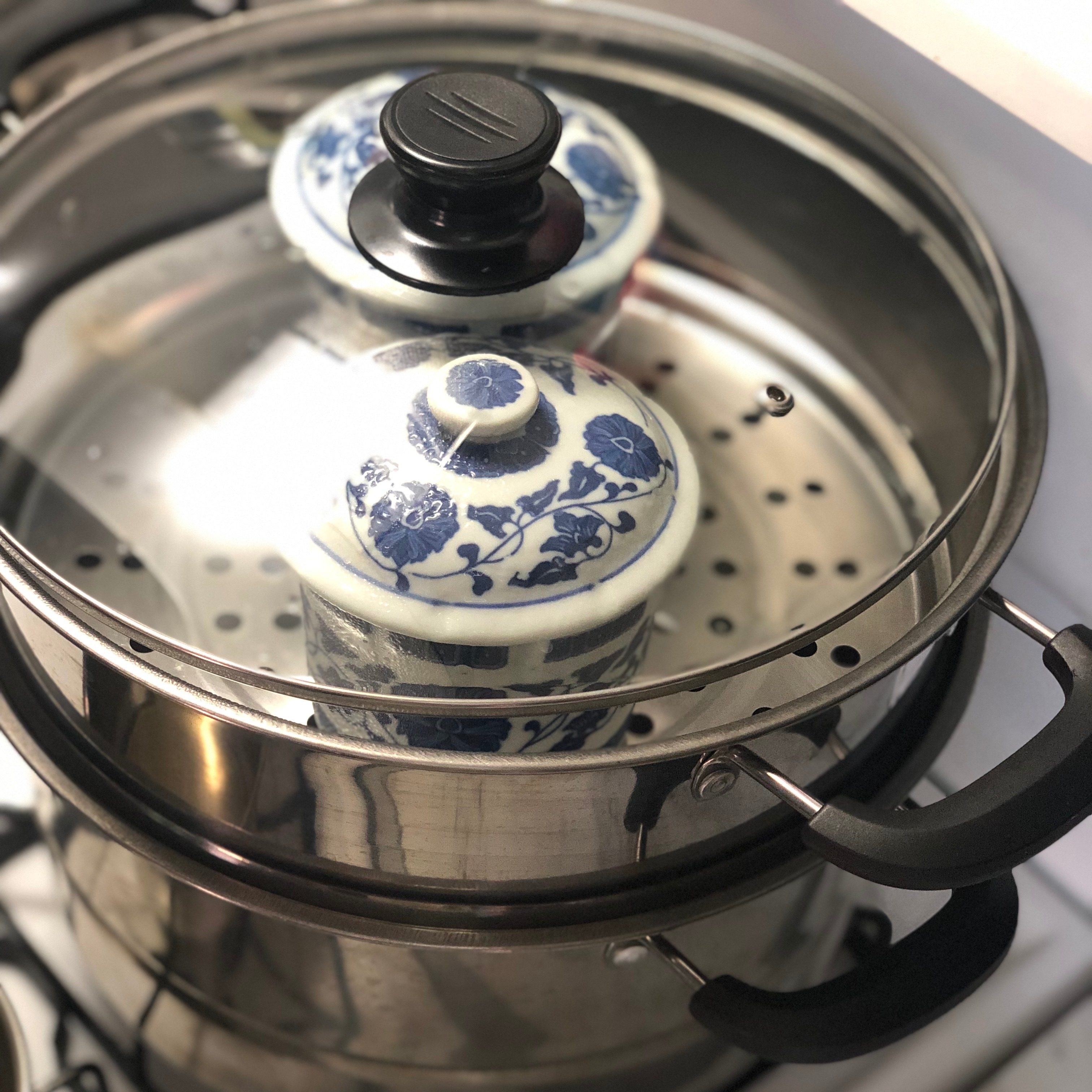 Placing the chawanmushi into the steamer