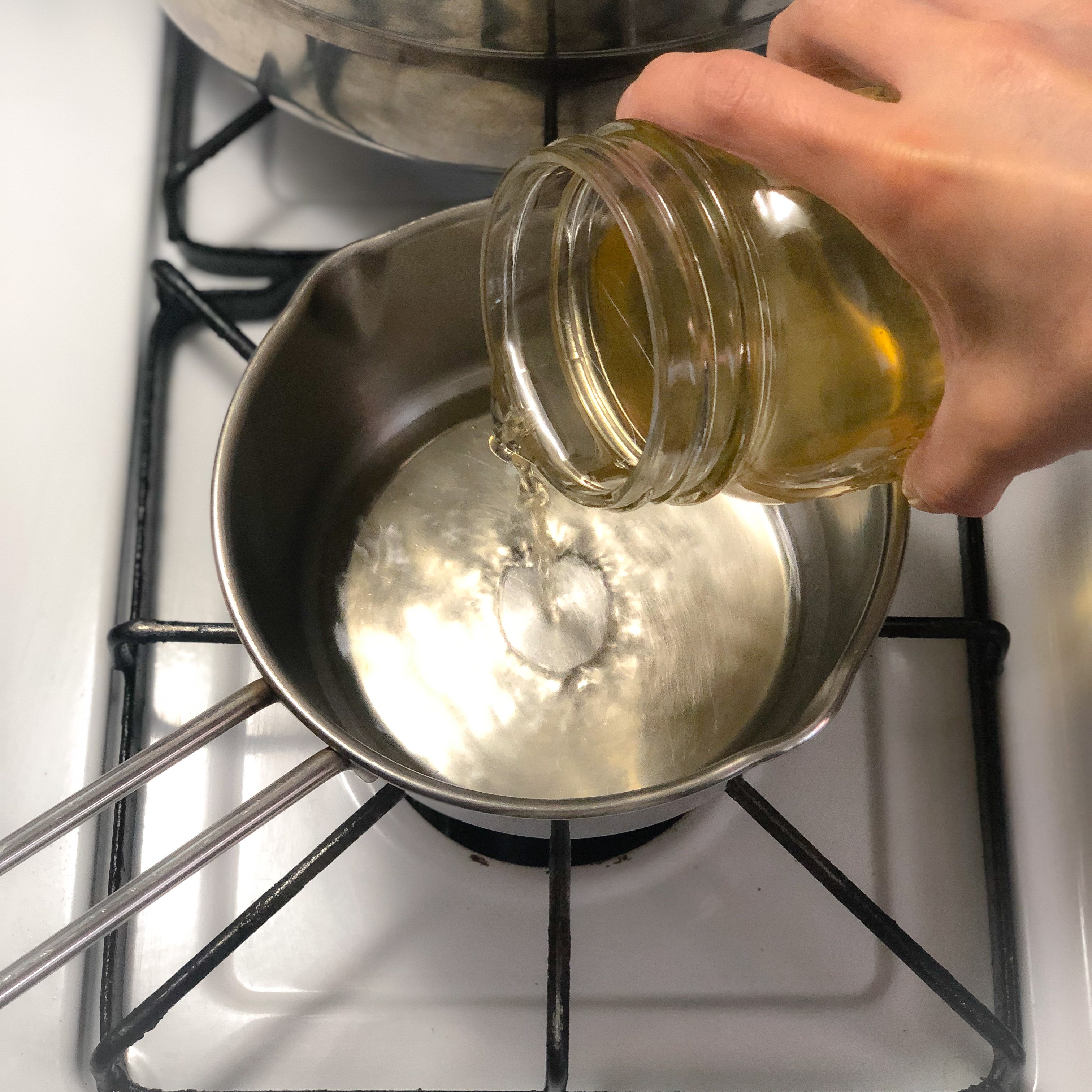Pouring dashi into a pot for the ankake sauce