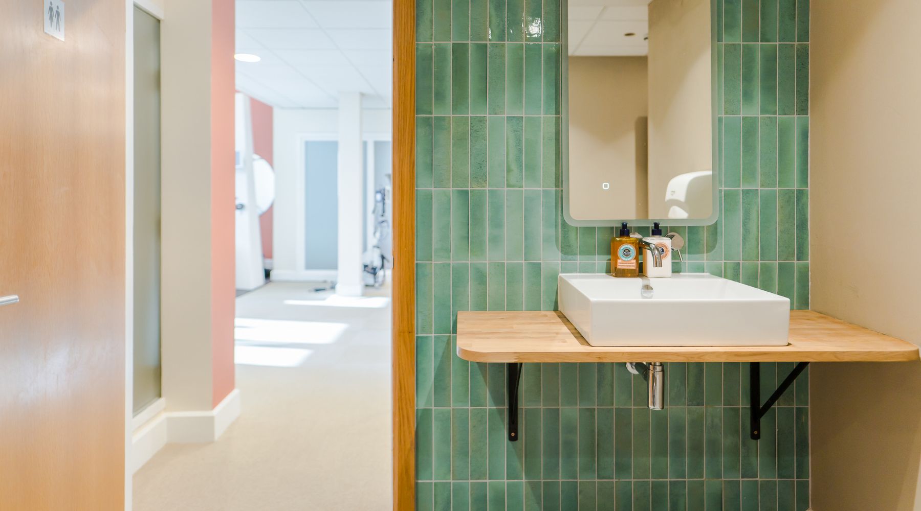 Motionspot designed accessible gym wall-mounted basin with attractive teal tiles at VIM Health.  