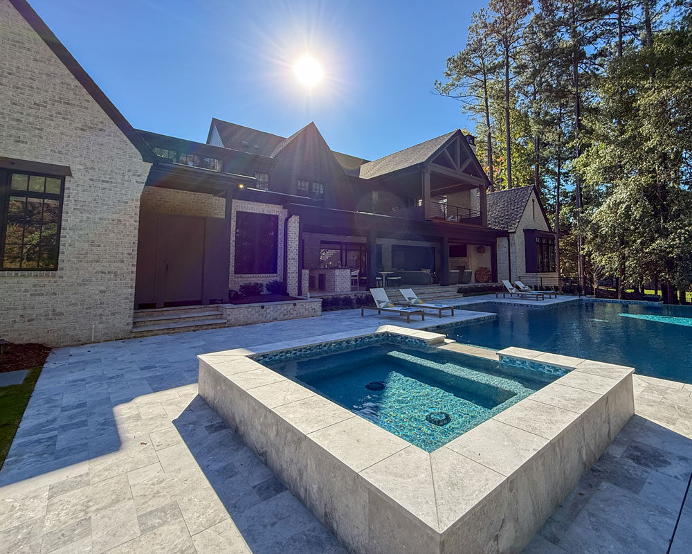 Back view of home with swimming pool