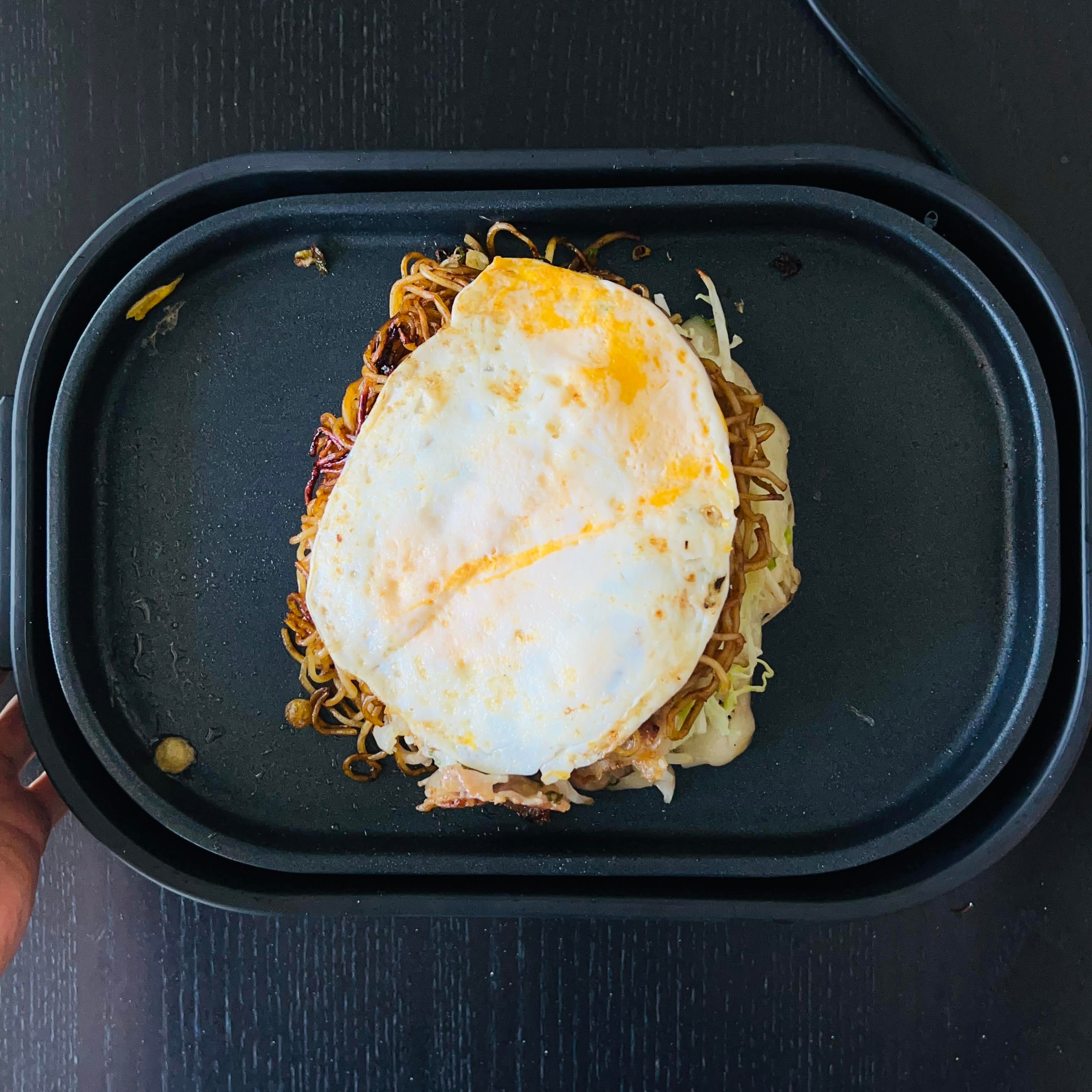 flipping over the okonomiyaki