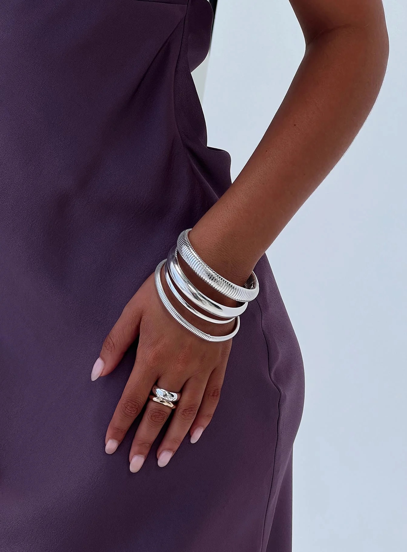 woman wearing silver bangles for christmas party